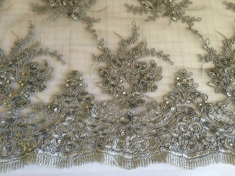 Gray marvy flower design embroider with glass beads and sequins on a mesh lace yd