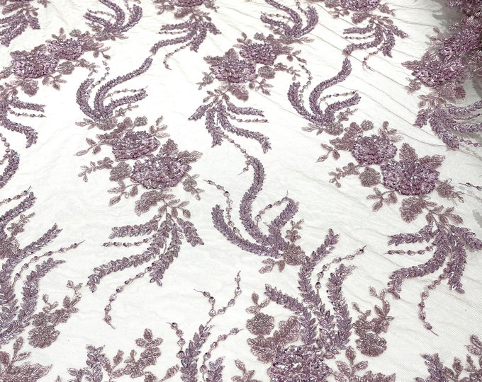 Mauve flowers embroider and heavy beaded on a mesh lace fabric-sold by the yard.