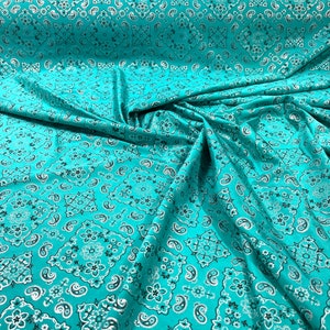 Jade metallic bandanna print on a stretch tricot spandex fabric- Sold by the yard.