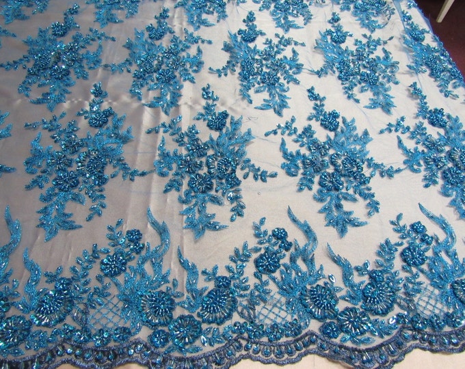 Gorgeous teal blue French design embroider and beaded on a mesh lace. Wedding/Bridal/Prom/Nightgown fabric.