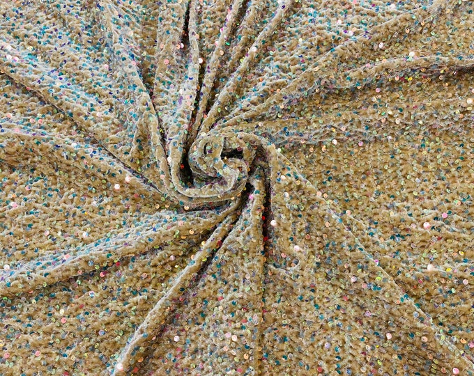 Clear Iridescent economic all over shiny sequins on a 2 way stretch Gold velvet , sold by the yard.