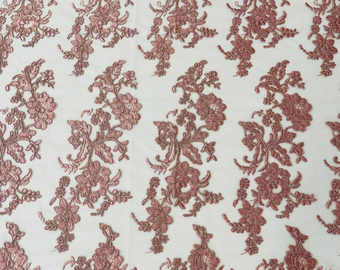 Dusty Rose floral design embroider and corded on a mesh lace fabric-sold by the yard.