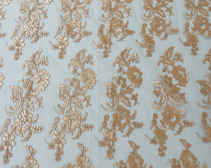 Blush peach floral design embroider and corded on a mesh lace fabric-sold by the yard.