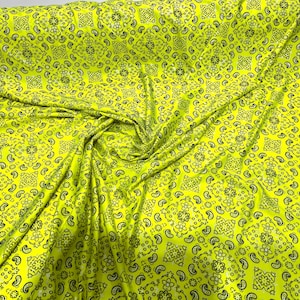 Neon Yellow metallic bandanna print on a stretch tricot spandex fabric- Sold by the yard.