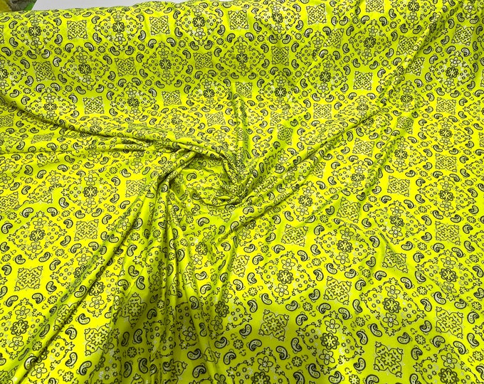 Neon Yellow metallic bandanna print on a stretch tricot spandex fabric- Sold by the yard.