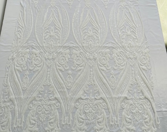 White empire damask design with sequins embroider on a 4 way stretch mesh fabric-sold by the yard.