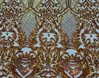 Orange iridescent sequin damask design on a nude 4 way stretch mesh-sold by the yard.