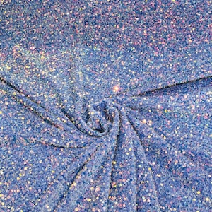 Clear iridescent 5mm sequins on a lavender stretch velvet 2-way stretch, sold by the yard.