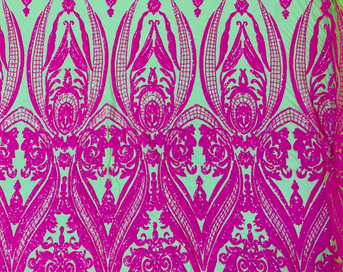 Hot pink empire damask design with sequins embroider on a neon green  4 way stretch mesh fabric-sold by the yard.