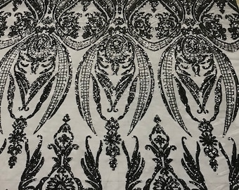 Black princess design embroidery with sequins on a 4 way Stretch Mesh-sold by the yard.