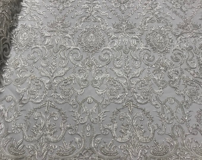 Ivory floral damask embroider and heavy beaded on a mesh lace fabric-sold by the yard-
