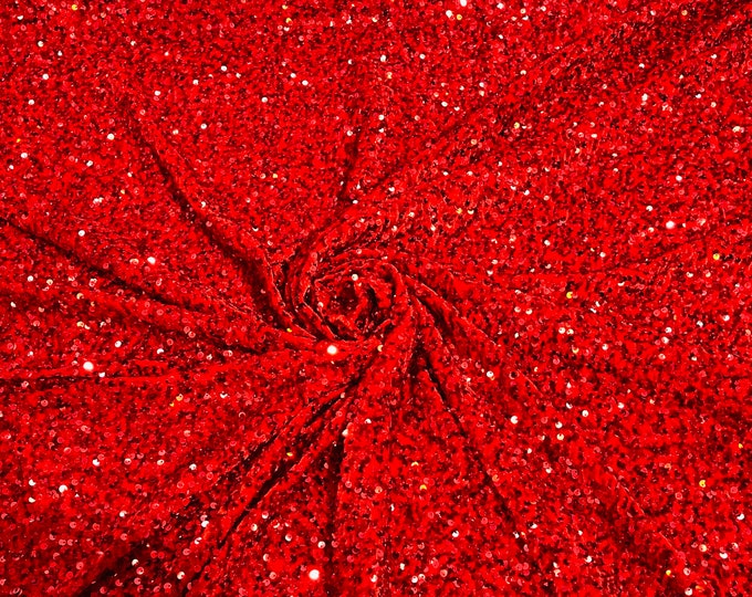 Red 5mm sequins on a stretch velvet 2-way stretch, sold by the yard.