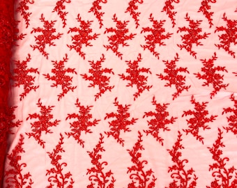 Red flowers embroider with sequins and heavy beaded on a mesh lace fabric-sold by the yard.