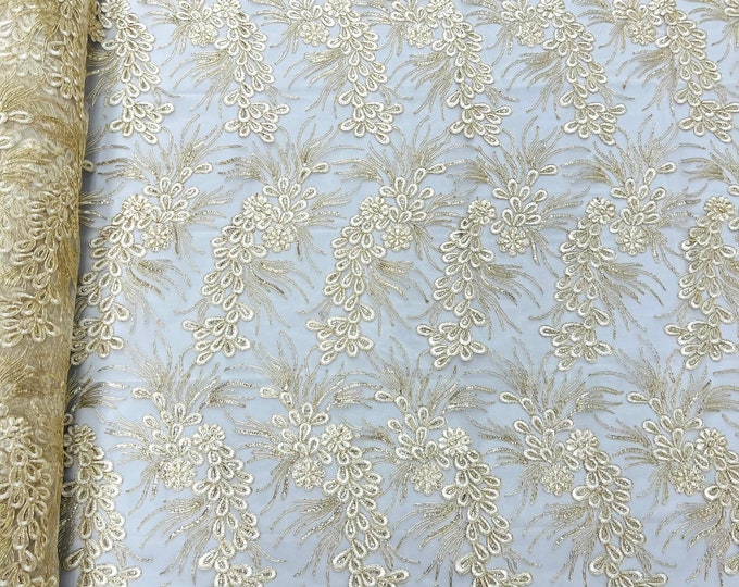 Ivory/gold feather design lace with metallic cord and embroider with sequins on a mesh-Sold by the yard.
