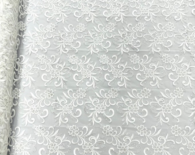 White corded flowers embroider with sequins on a mesh lace fabric-sold by the yard-