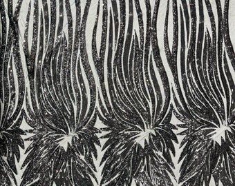 Black sequin Wings design on a black 4 way stretch mesh fabric- prom-nightgown-by the yard-free shipping in the USA.