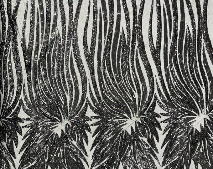 Black sequin Wings design on a black 4 way stretch mesh fabric- prom-nightgown-by the yard-free shipping in the USA.