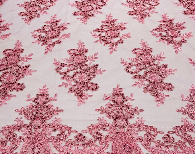 Candy pink corded flowers embroider with sequins on a mesh lace fabric-sold by the yard.