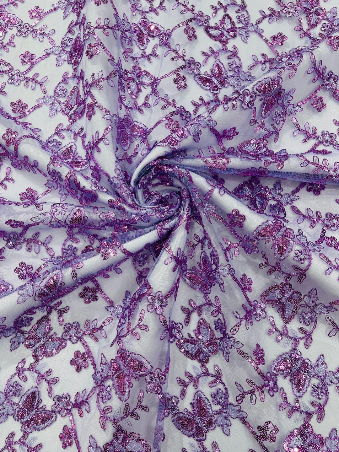 Wings Design Embroider and heavy beading on a mesh lace-sold by the yard. Lilac
