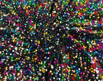 Rainbow economic all over shiny sequins on a 2 way stretch Black velvet , sold by the yard.
