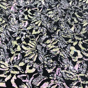 Pink, silver iridescent sequins flip two tone floral design on a black stretch velvet, Sold by the yard.