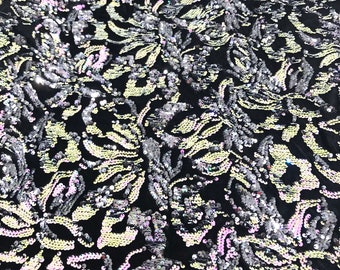 Pink, silver iridescent sequins flip two tone floral design on a black stretch velvet, Sold by the yard.