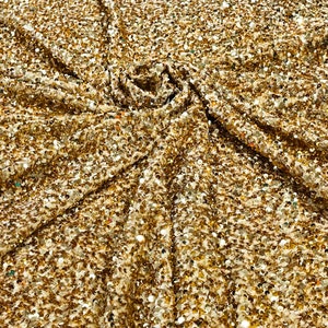 Gold 5mm sequins on a stretch velvet 2-way stretch, sold by the yard.