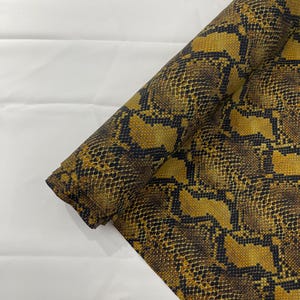 Brown/Black python snake print on a 4 way stretch nylon spandex/58” wide/sold by the yard.