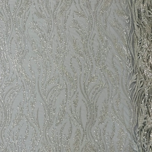 Silver/Clear Festival Design Embroider and heavy beading on a silver mesh lace-sold by the yard.