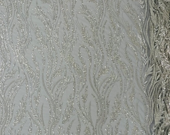 Silver/Clear Festival Design Embroider and heavy beading on a mesh lace-sold by the yard.