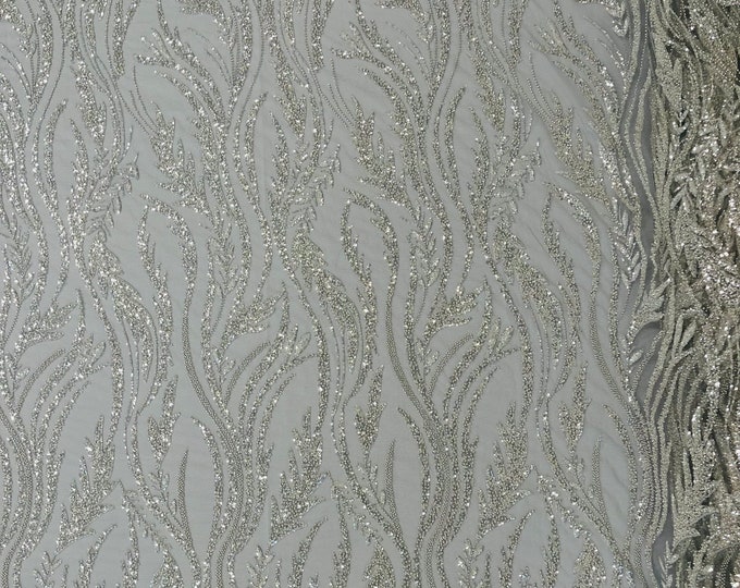 Silver/Clear Festival Design Embroider and heavy beading on a mesh lace-sold by the yard.