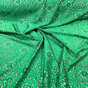 Green metallic bandanna print on a stretch tricot spandex fabric- Sold by the yard.