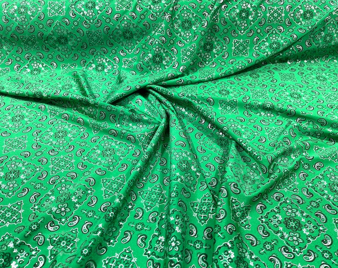 Green metallic bandanna print on a stretch tricot spandex fabric- Sold by the yard.