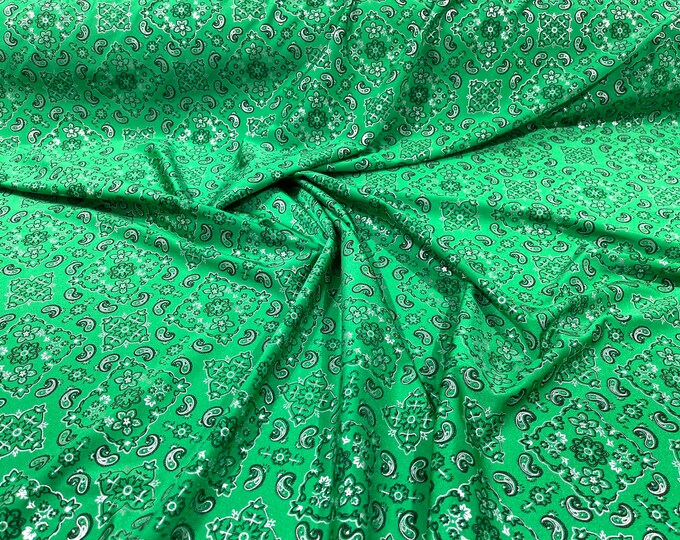 Green metallic bandanna print on a stretch tricot spandex fabric- Sold by the yard.