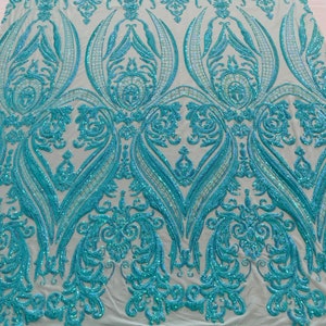 Mint aqua iridescent empire damask design with sequins embroider on a mint 4 way stretch mesh fabric-sold by the yard.