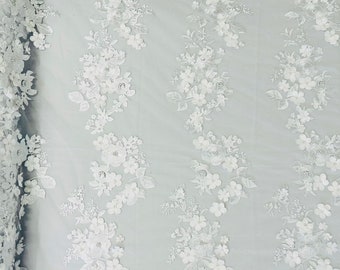 White Diana 3d floral design embroider with pearls in a mesh lace-sold by the yard.