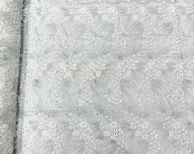 White/silver  feather design lace with metallic cord and embroider with sequins on a mesh-Sold by the yard.