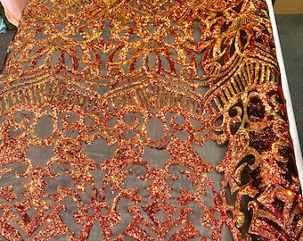 Orange royalty iridescent sequins on a 4 way Stretch black mesh lace-dresses-fashion-apparel-prom-nightgown-sold by the yard.