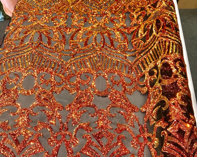 Orange royalty iridescent sequins on a 4 way Stretch black mesh lace-dresses-fashion-apparel-prom-nightgown-sold by the yard.