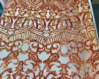 Orange royalty iridescent sequins on a 4 way Stretch nude mesh-dresses-fashion-apparel-prom-nightgown-sold by the yard.