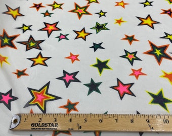 Multi color star design on a ivory power mesh 4-way stretch 58"-Sold by the yard