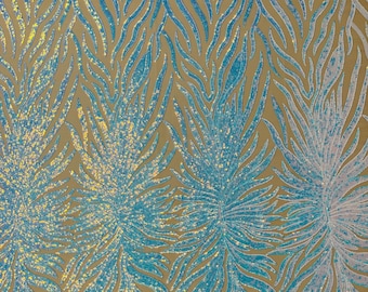 Aqua iridescent phoenix feather design with sequins embroider on a Nude 4 way stretch mesh fabric-sold by the yard.