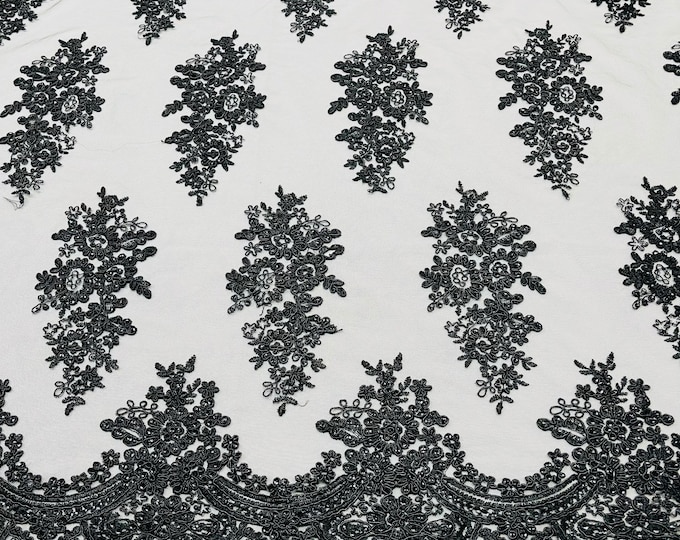 Black corded embroider with sequins on a mesh lace fabric-prom-sold by the yard.