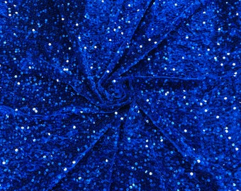 Royal Blue economic all over shiny sequins on a 2 way stretch velvet , sold by the yard.
