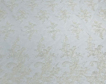 Ivory Gomez Floral design corded embroider with sequins on a mesh lace fabric-sold by the yard.