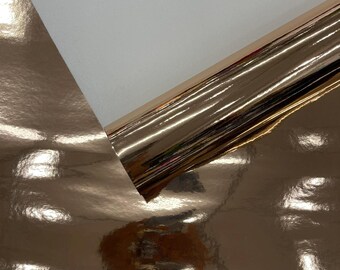 Tessuto vinilico effetto specchio cromato, materiale di rivestimento riflettente color oro rosa, larghezza 54 pollici.