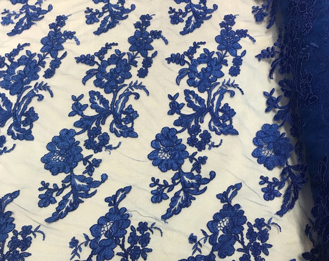 Royal Blue floral design embroider and corded on a mesh lace-sold by the yard.