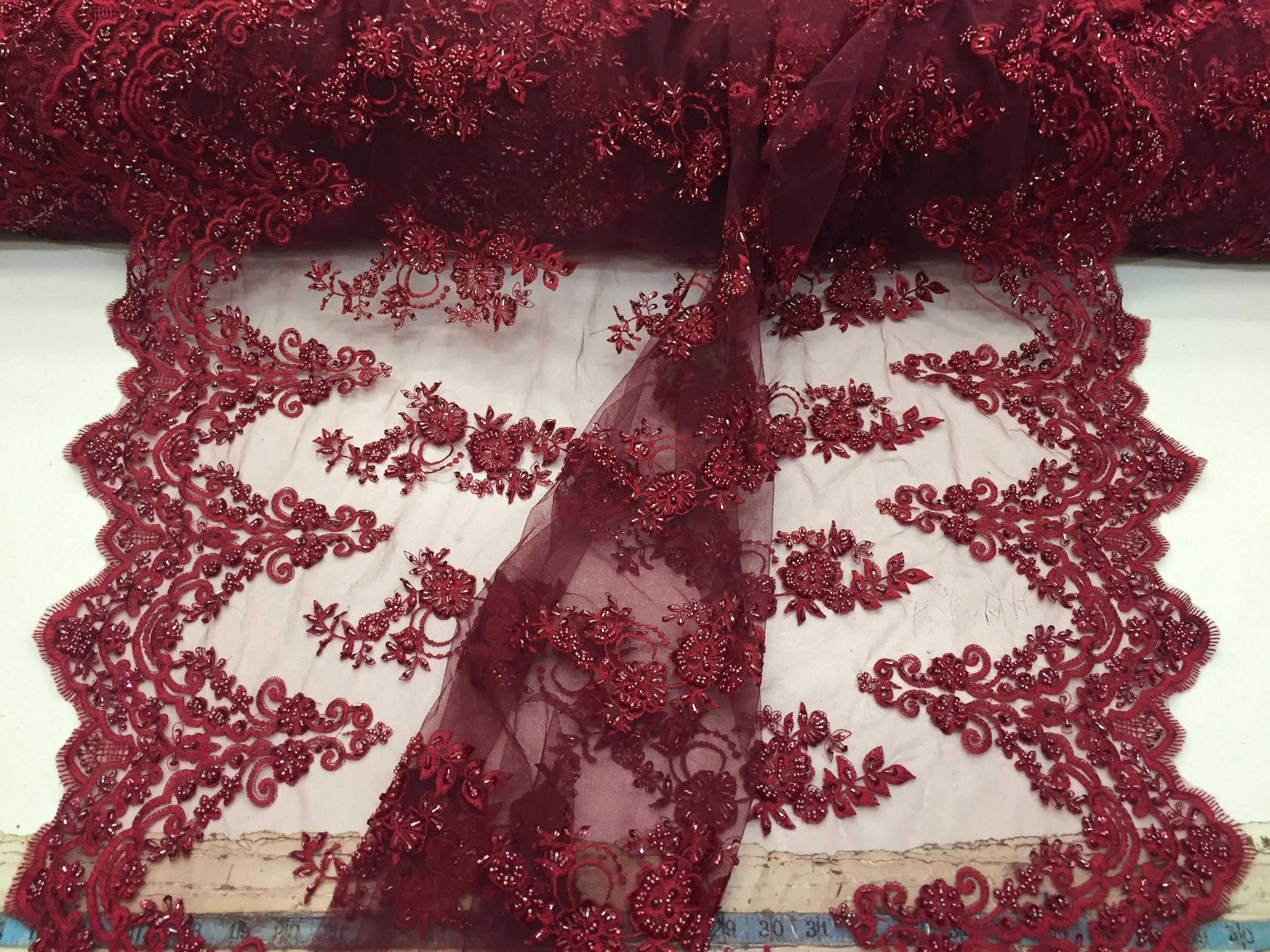 BURGUNDY HAND BEADED FLORAL DESIGN EMBROIDERY ON A MESH LACE-SOLD BY YARD. 