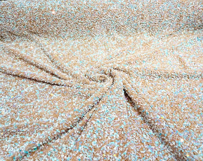 Aqua /white iridescent 5mm sequins on a nude stretch velvet 2-way stretch, sold by the yard.