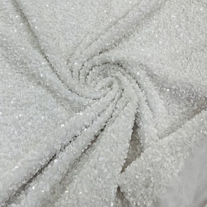 White glossy 5mm sequins on a stretch velvet/Sold by the yard.